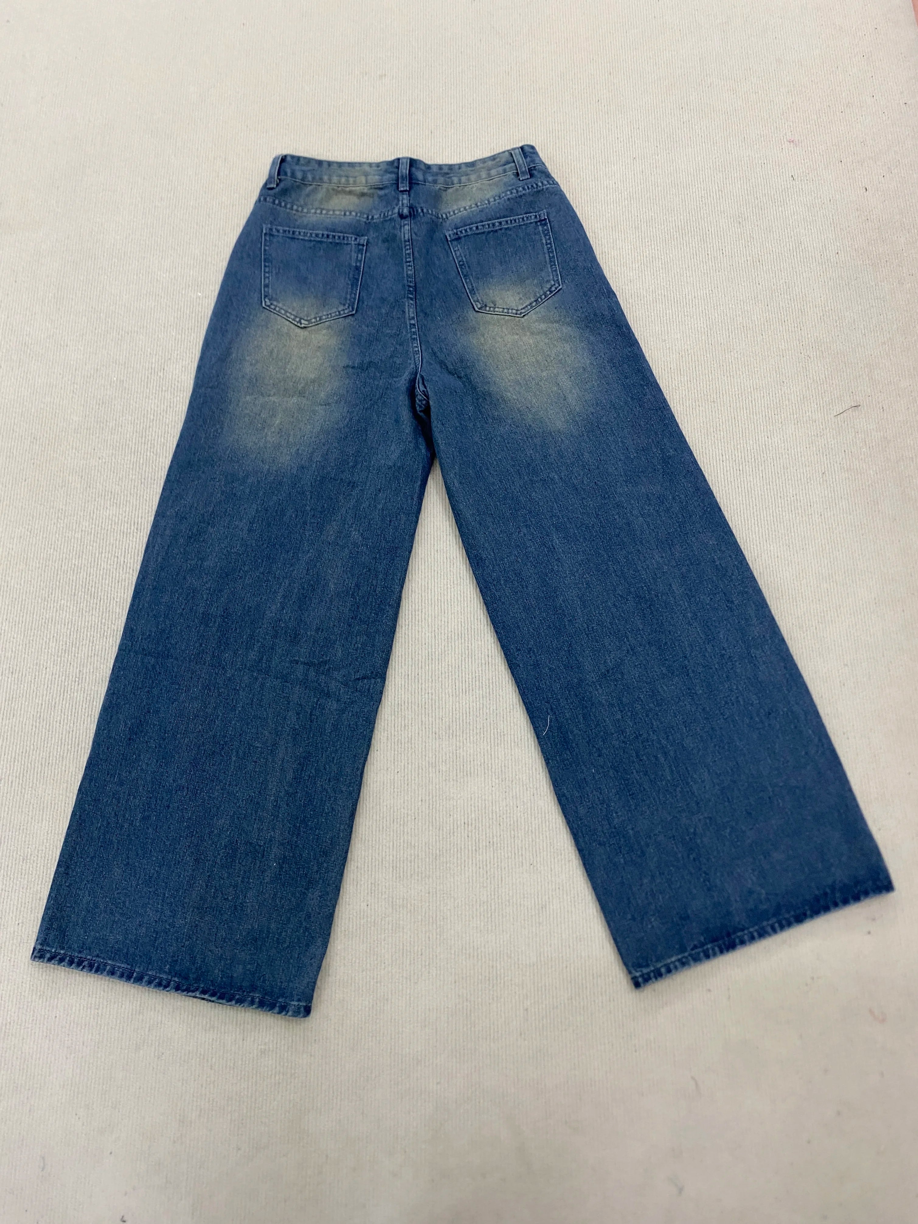 New denim pants for both men and women, specially designed for simple daily wear with holes and knees, rivet jeans