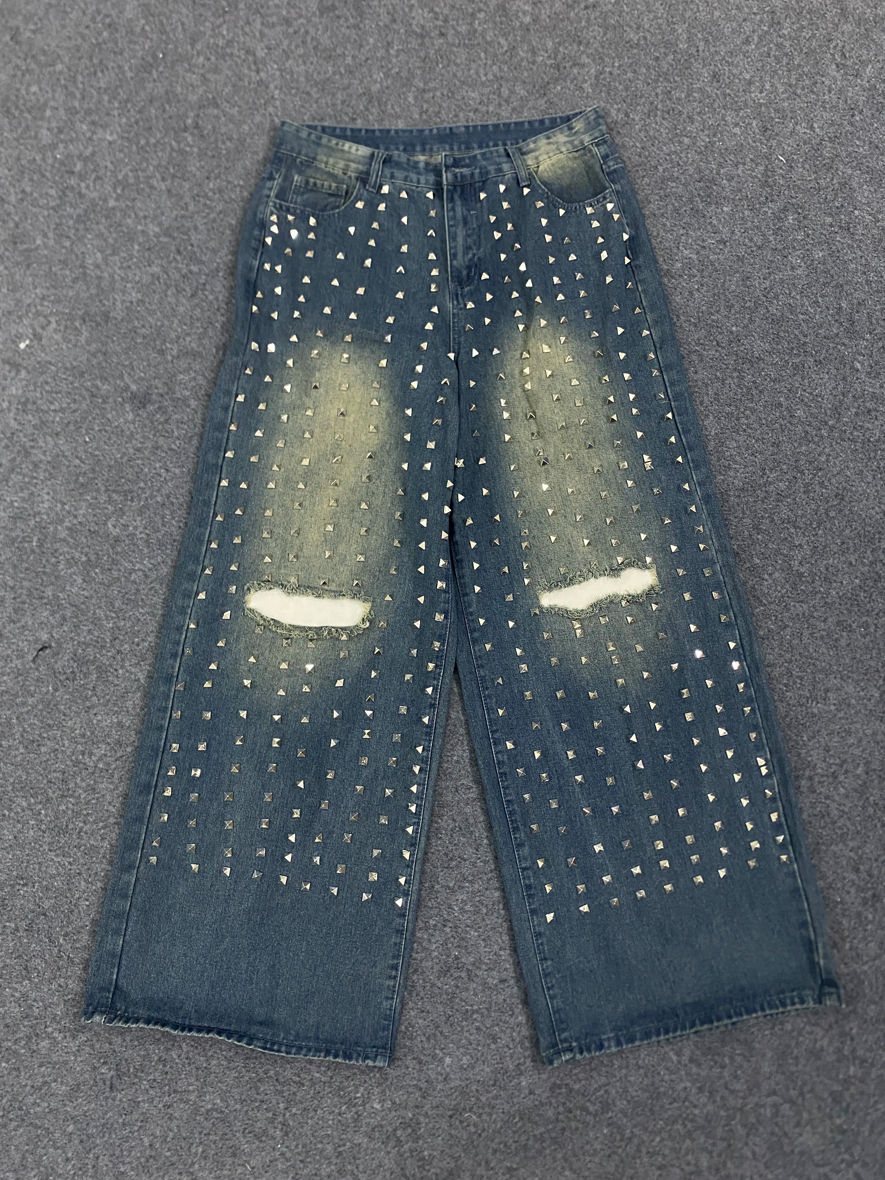 New denim pants for both men and women, specially designed for simple daily wear with holes and knees, rivet jeans