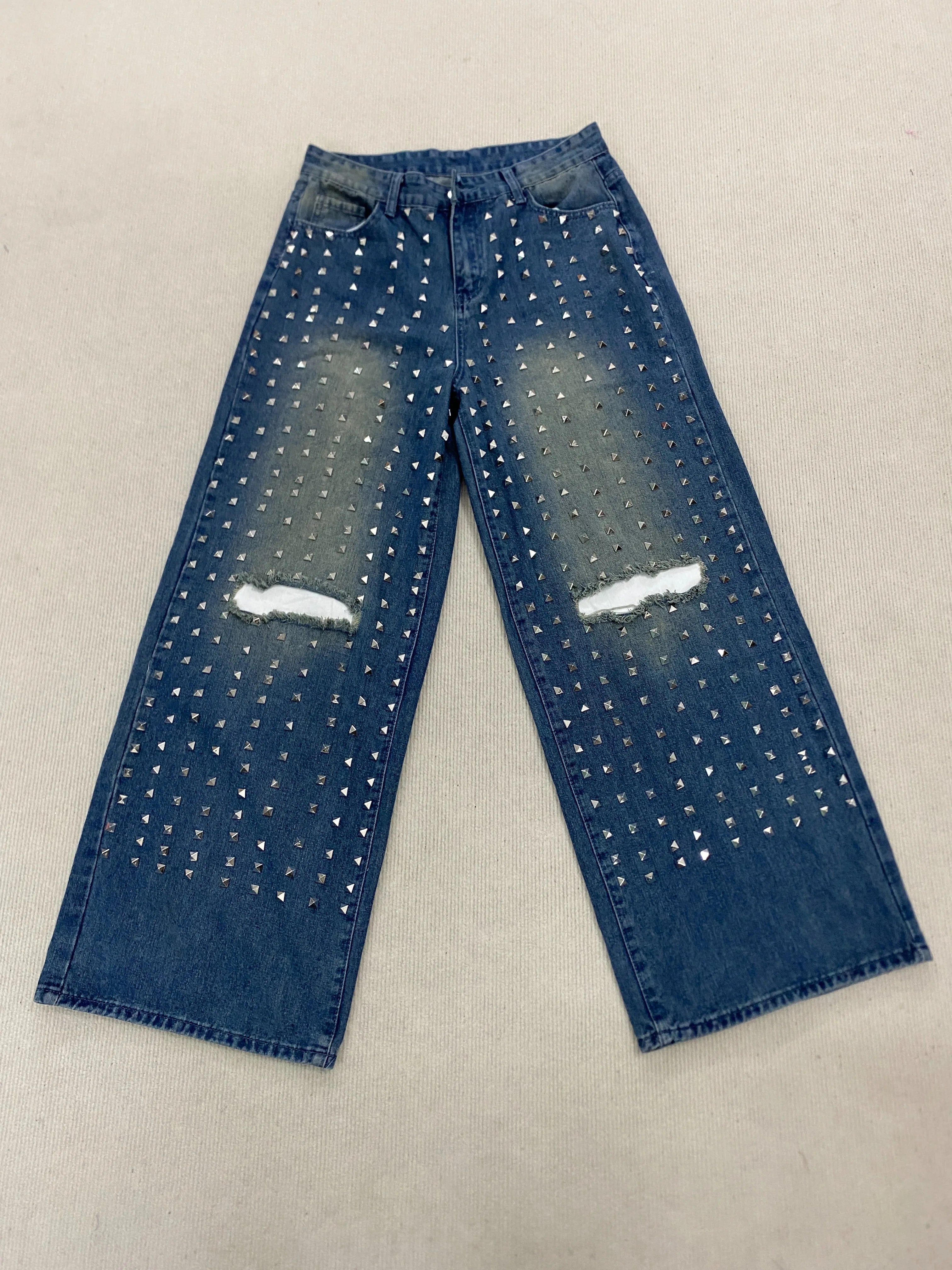 New denim pants for both men and women, specially designed for simple daily wear with holes and knees, rivet jeans
